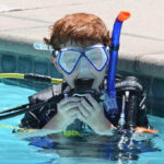 children scuba diving